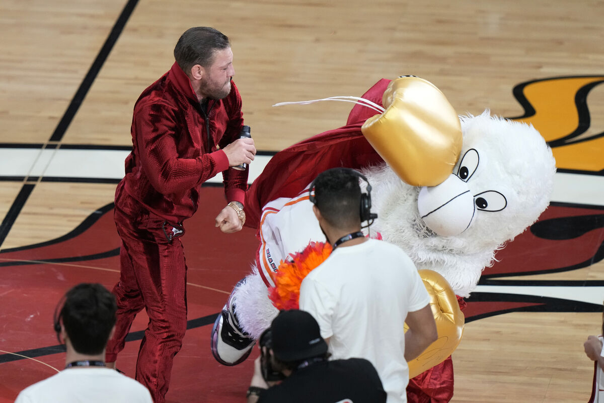 Conor McGregor punches Burnie, the Miami Heat mascot, during a break in Game 4 of the basketball NBA finals against the Denver Nuggets on June 9. Picture: Lynne Sladky/AP