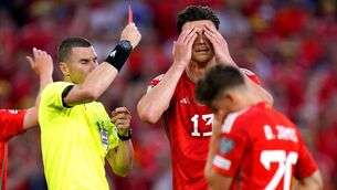 <p>OH NO: Wales' Kieffer Moore reacts after being shown a red card for a foul on Armenia goalkeeper Ognjen Cancarevic during the UEFA Euro 2024 Qualifying Group D match at the Cardiff City Stadium, Cardiff. Pic: PA Wire</p>