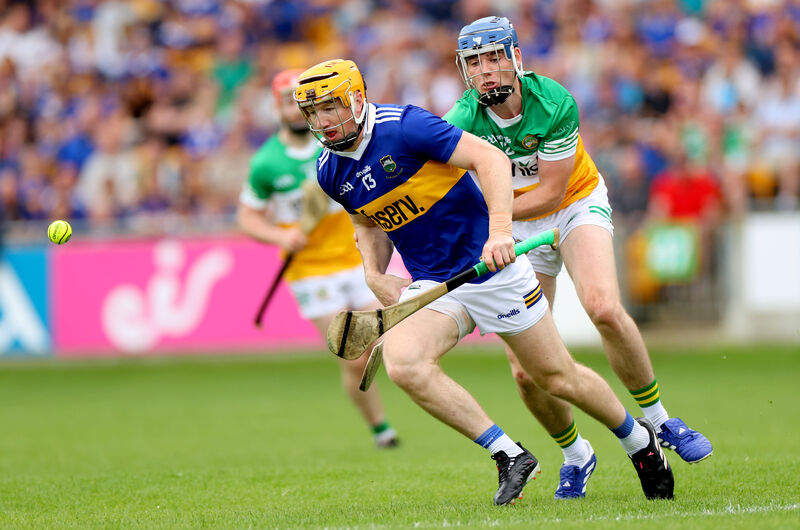 Tipperary’s Jake Morris and Adrian Cleary of Offaly Tipperary’s Jake Morris and Adrian Cleary of Offaly