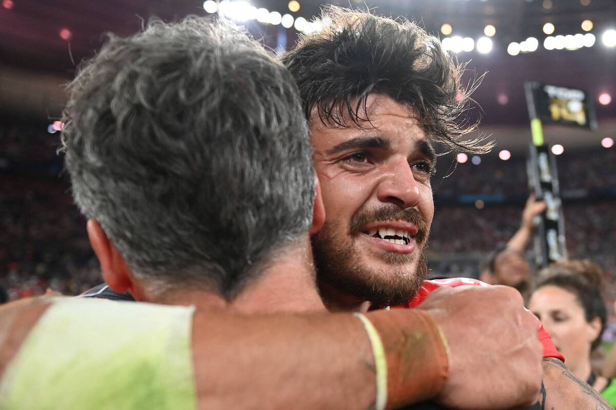 Toulouse's French fly-half Theo Ntamack (R) celebrate the victory with Toulouse's French coach Ugo Mola at the end of the French Top14 rugby union final match between Stade Toulousain Rugby (Toulouse) and Stade Rochelais (La Rochelle) at the Stade de France in Saint-Denis  (Photo by FRANCK FIFE/AFP via Getty Images)