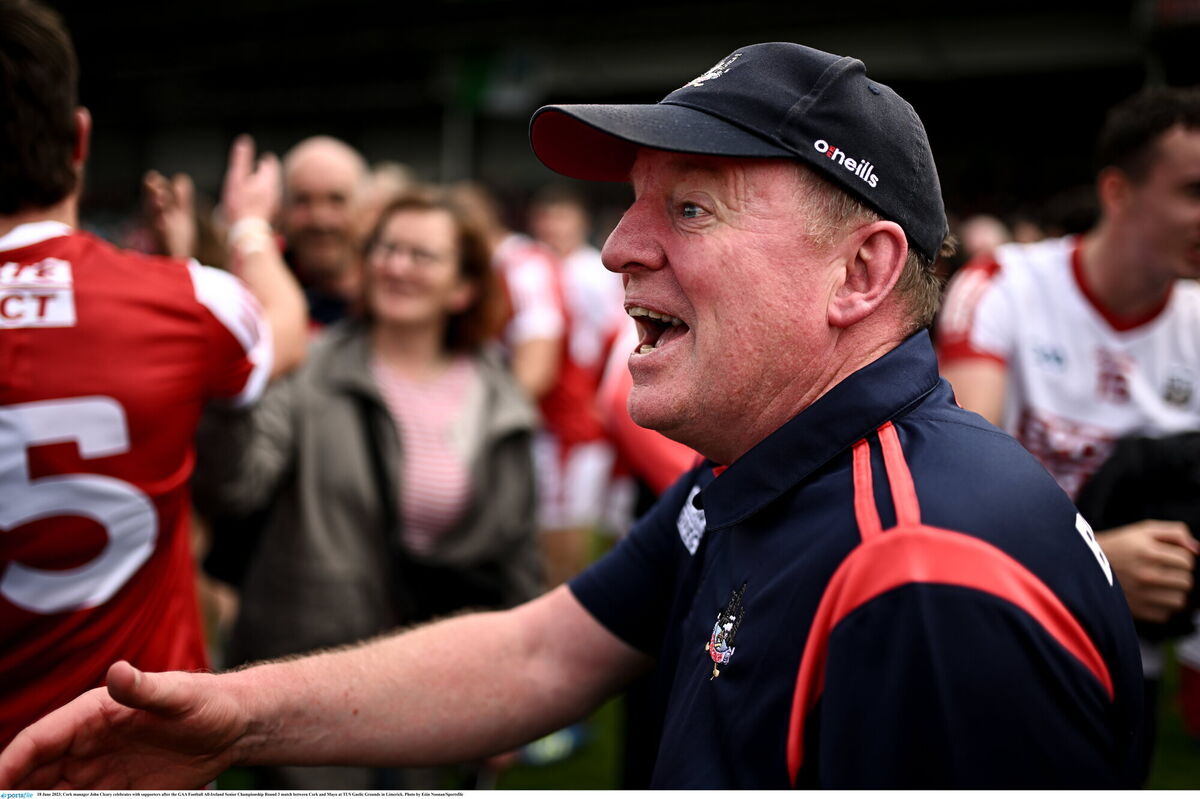 Cork manager John Cleary celebrates with supporters after the win. 