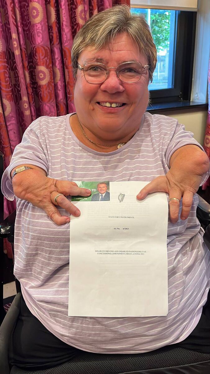 Leigh Gath holding the new legislation around supports for disabled drivers. 