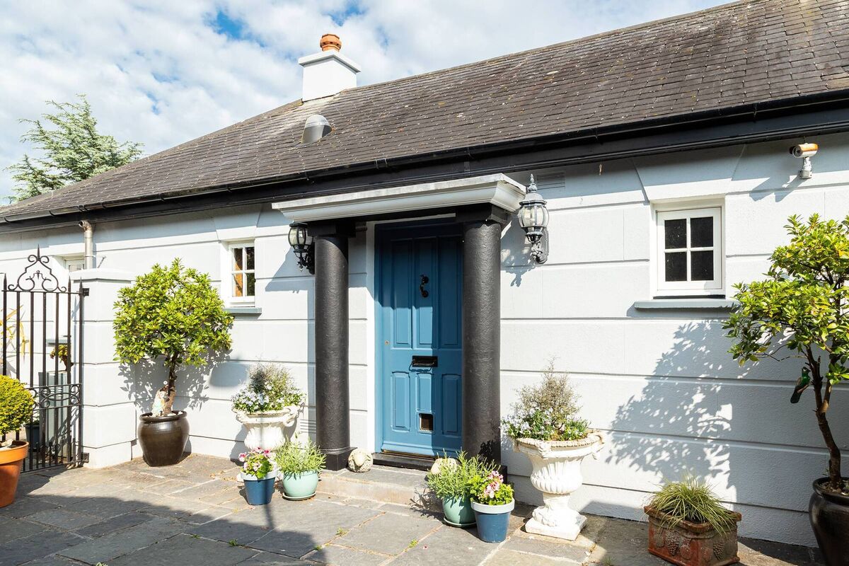 Entrance from parking area seems modest, and is set below road height on landscaped gardens Entrance from parking area seems modest, and is set below road height on landscaped gardens