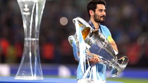 <p>BARCA BOUND: Manchester City's Ilkay Gundogan with the UEFA Champions League Trophy.</p>