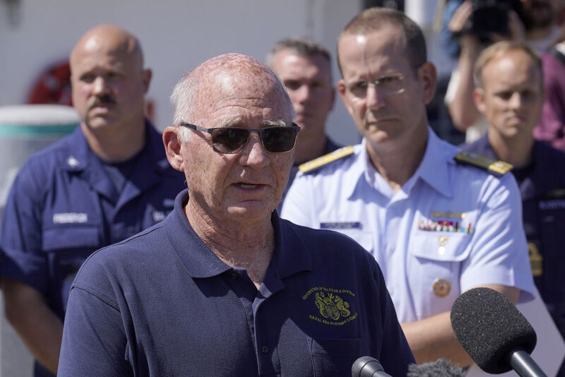 Paul Hankins, US Navy civilian contractor, supervisor of salvage, front, talks to the media as US Coast Guard Rear Adm John Mauger, commander of the First Coast Guard District, center right, looks on, Thursday, June 22, 2023, at Coast Guard Base Boston. Picture: AP Photo/Steven Senne Paul Hankins, US Navy civilian contractor, supervisor of salvage, front, talks to the media as US Coast Guard Rear Adm John Mauger, commander of the First Coast Guard District, center right, looks on, Thursday, June 22, 2023, at Coast Guard Base Boston. Picture: AP Photo/Steven Senne