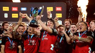 <p>SEVEN-IN-A-ROW: Scott Barrett holds the Super Rugby Pacific trophy as the Crusaders celebrate after winning the Super Rugby Pacific Final. Pic: Phil Walter/Getty Images</p>