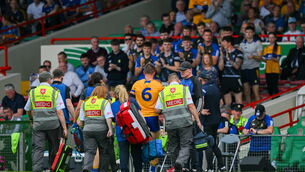 <p>CONCERN: Clare hurling manager Brian Lohan looks on as John Conlon of Clare leaves the field injured. Pic: Ray McManus/Sportsfile</p>