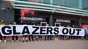 <p>PROTEST: Manchester United fans gather outside Old Trafford as they protest against the ownership of the club. Pic: Peter Byrne/PA Wire</p>