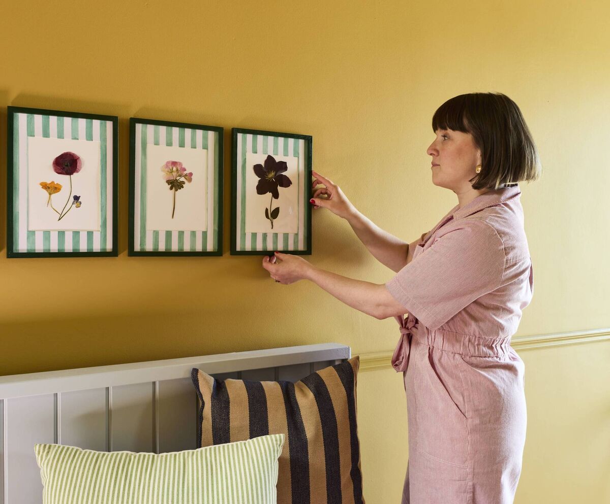 Pictures of flowers Elaine picked and pressed herself last summer adorn the walls in the new hallway.