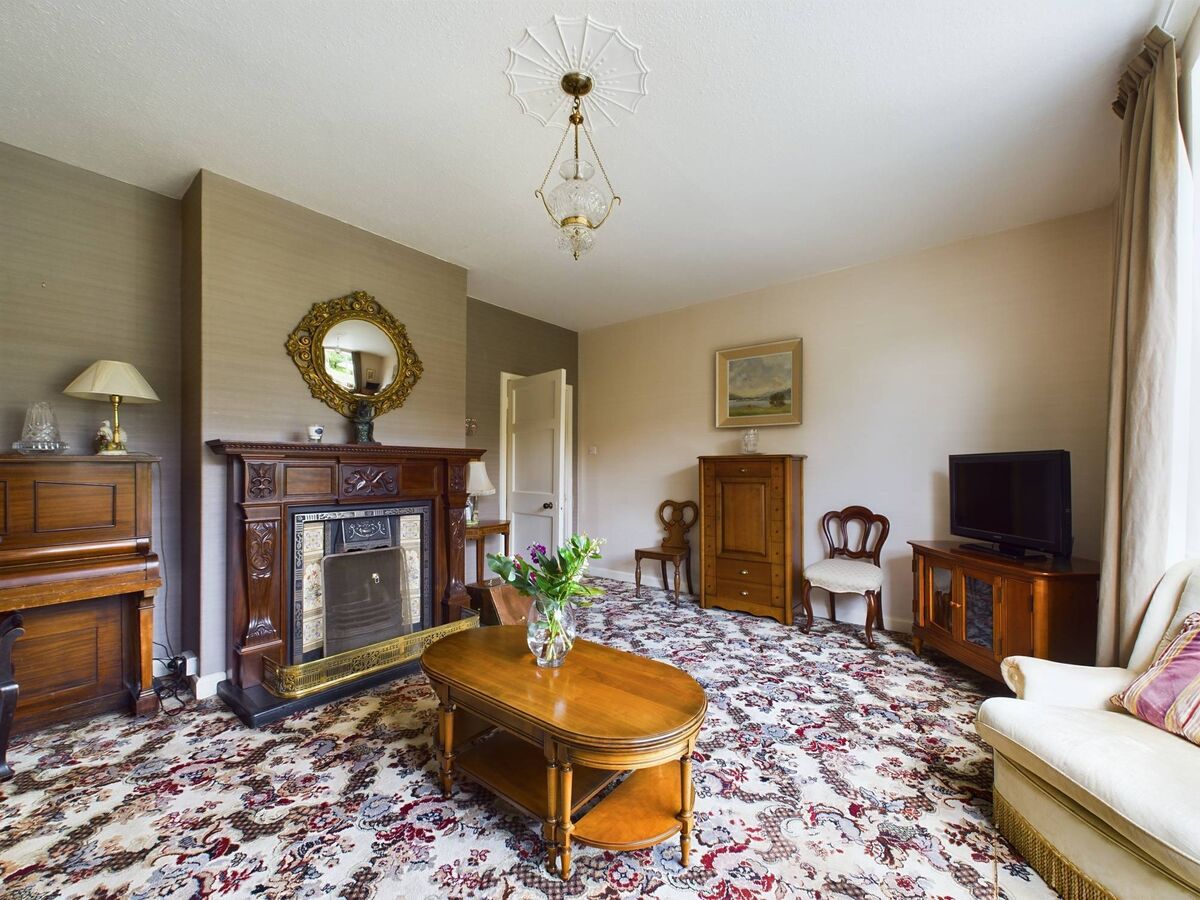 One of the two fine reception rooms, with notably high ceilings One of the two fine reception rooms, with notably high ceilings
