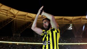 <p>Karim Benzema acknowledges the fans as they are presented to the crowd during the Karim Benzema Official Reception event at King Abdullah Sports City in Jeddah, Saudi Arabia. Pic: Yasser Bakhsh/Getty Images</p>