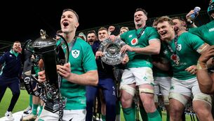 <p>WINNERS: Ireland’s Johnny Sexton lifts the Six Nations trophy after winning the Grand Slam. </p>