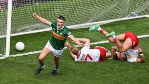 <p>UPSIDE DOWN: Kerry's Sean O'Shea scores their second goal en route to a comprehensive 12-point win over Tyrone at Croke Park in Dublin.</p>