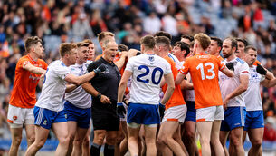 <p>MAN IN THE MIDDLE: Referee Conor Lane is surrounded as tempers flare between the two teams at the end of normal time. Picture: INPHO/Ben Brady</p>