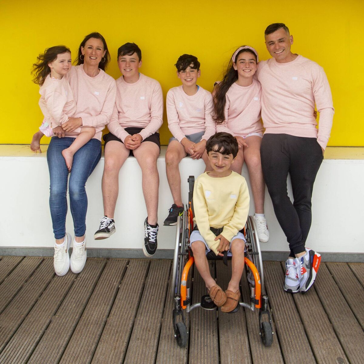 Adam King and his family — Sarah, Fiona, Danny, Robert, Adam, Katie and David — model Human Collective’s new sustainable range of clothing.