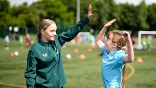 <p>AIMING HIGH: Republic of Ireland's Izzy Atkinson with Sophia Maher during a visit from Republic of Ireland women's team players to the Hartstown Huntstown FC INTERSPORT Elverys FAI Football Camp in Dublin. Pic: Stephen McCarthy/Sportsfile</p>