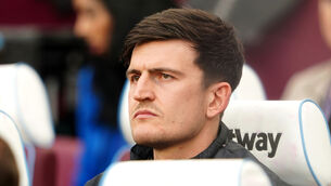 <p>CHALLENGING: Manchester United's Harry Maguire on the bench prior to kick-off in the Premier League match at the London Stadium.</p>