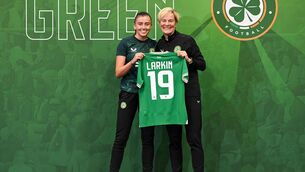 <p>Abbie Larkin is presented with her jersey by Republic of Ireland manager Vera Pauw during a Republic of Ireland FIFA Women's World Cup 2023 squad announcement event at O'Reilly Hall in UCD, Dublin. Photo by Stephen McCarthy/Sportsfile </p>