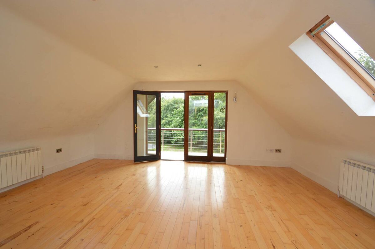 Main bedroom with access to sheltered balcony