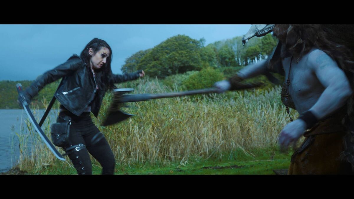 Niamh Hogan dodges an axe in Demon Hunter: Time 2 Kill