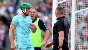 <p>Limerick goalkeeper Nickie Quaid receives treatment </p>