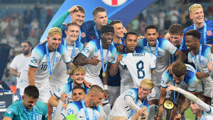 Taylor Hardwood-Bellis, front, third from right, celebrates with his England team-mates after victory over Spain (PA)