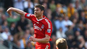 <p>PASS MATER: Xabi Alonso of Liverpool jumps for joy as he celebrates the opening goal during the Barclays Premier League match between Hull City and Liverpool at the KC Stadium on April 25, 2009. Pic: Laurence Griffiths/Getty Images.</p>
