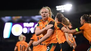 <p>INSPIRE ALL: Amber Barrett touches the black armband after scoring the crucial goal against Scotland at Hampden Park. Pic: Stephen McCarthy/Sportsfile</p>