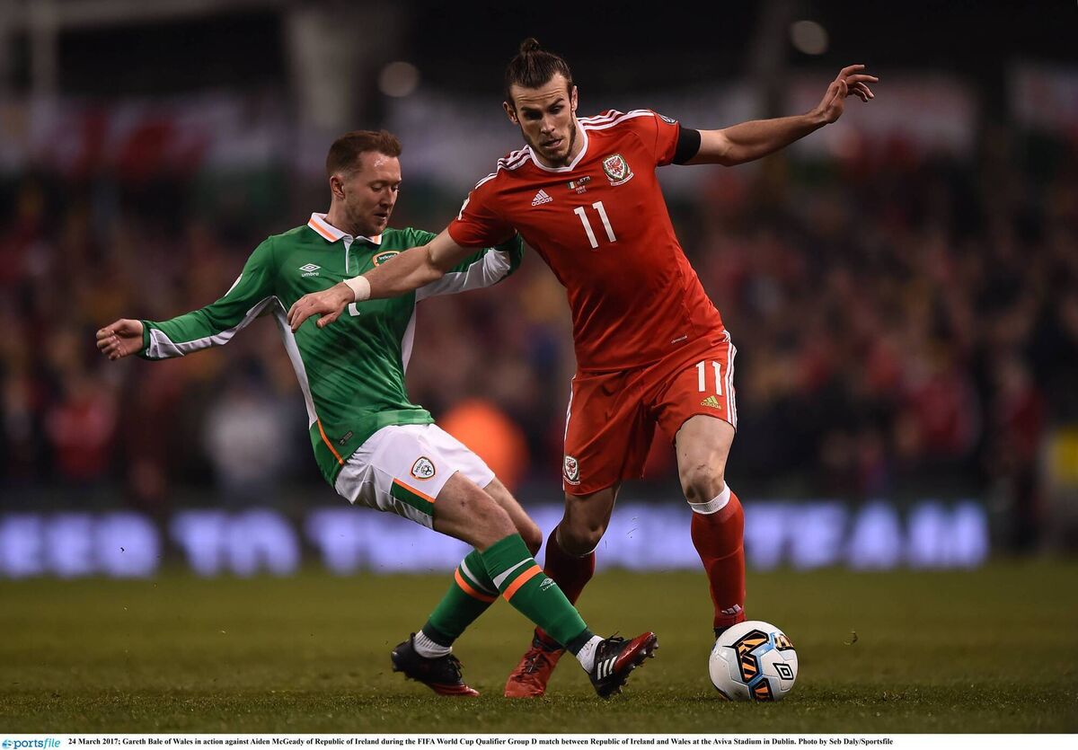 GREEN DREAMS: Gareth Bale of Wales in action against Aiden McGeady of Republic of Ireland during the FIFA World Cup Qualifier Group D match between Republic of Ireland and Wales at the Aviva Stadium in Dublin. Pic: Seb Daly/Sportsfile