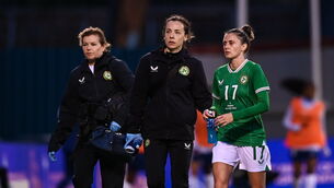 <p>MANAGING PLAYERS HEALTH: Republic of Ireland's Sinead Farrelly leaves the field alongside Republic of Ireland physiotherapist Angela Kenneally and team doctor Siobhan Forman during the women's international friendly match against France. Pic: Stephen McCarthy/Sportsfile</p>