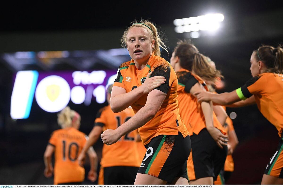 Hometown hero: Amber Barrett touches the black armband after scoring the crucial goal against Scotland at Hampden Park. Pic credit: Stephen McCarthy/Sportsfile