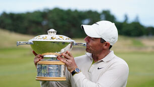 Rory McIlroy kisses the trophy (Jane Barlow/PA)