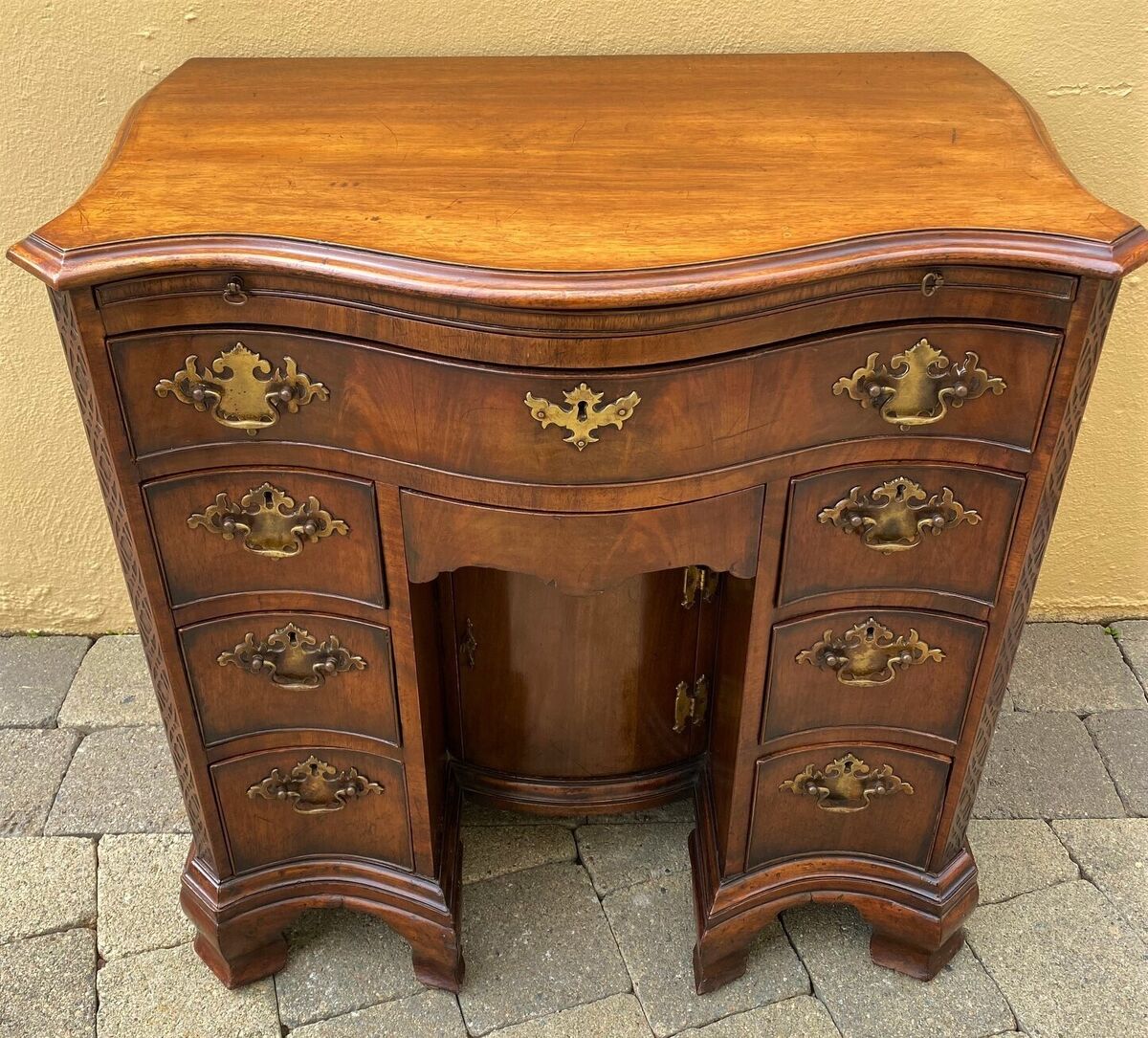 A neatly sized 19th-century Chippendale-style desk. A neatly sized 19th-century Chippendale-style desk.