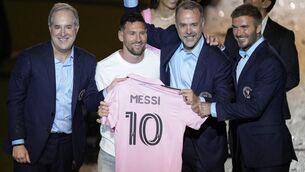 <p>U-MESS-A: Inter Miami’s Lionel Messi, centre left, holds his new Inter Miami shirt (Rebecca Blackwell/AP)</p>