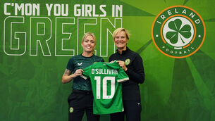 <p>Denise O'Sullivan, left, is presented with her jersey by Republic of Ireland manager Vera Pauw during a media day at O'Reilly Hall, Dublin, in June. </p>