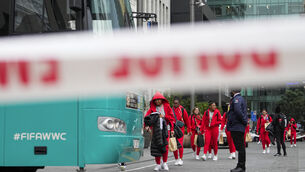 Members of the Philippines Women’s World Cup team walk to their team bus following a shooting near their hotel in the central business district in Auckland (Abbie Parr/AP)