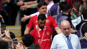 <p>PASSING THE TORCH: Manchester United's Bruno Fernandes walks ahead of former captain harry Maguire. Pic: Nick Potts/PA Wire.</p>