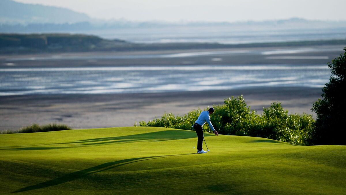 TIME AND TIDE: Northern Ireland's Rory McIlroy putts on the 17th green green during day one of The Open at Royal Liverpool, Wirral. Pic: David Davies/PA Wire. TIME AND TIDE: Northern Ireland's Rory McIlroy putts on the 17th green green during day one of The Open at Royal Liverpool, Wirral. Pic: David Davies/PA Wire.