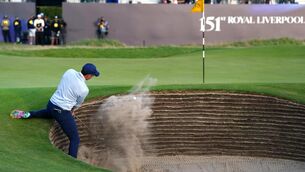 <p>KNEESY DOES IT: Ireland's Rory McIlroy chips out of a bunker on the 18th during day one of The Open at Royal Liverpool, Wirral. Picture date: Thursday July 20, 2023. Pic: James Warwich/PA</p>