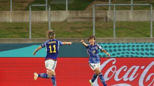<p>OFF TO FLYING START: Hinata Miyazawa (R) of Japan celebrates with teammate Mina Tanaka (L) after scoring her team's first goal during game against Zambia. Pic: Catherine Ivill/Getty Images</p>