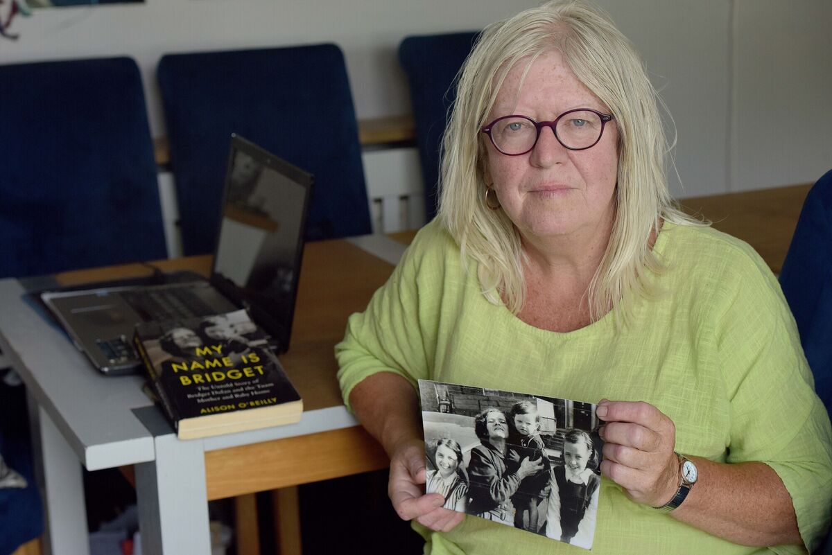  Anna Corrigan, campaigner and spokesperson for the Tuam Babies Family Group with a photograph of her mother Bridget holding her as a young girl. Picture: Moya Nolan
