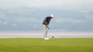 <p>IN CONTROL: Brian Harman putts on the 17th green during day three of The Open at Royal Liverpool, Wirral. Pic: David Davies/PA Wire</p>