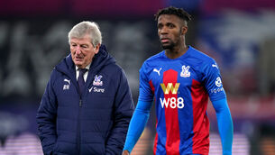 <p>Roy Hodgson, left, paid tribute to Wilfried Zaha (John Walton/PA)</p>