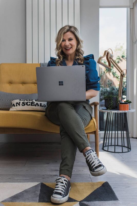 Clíodhna Barlow perched on an upcycled couch.