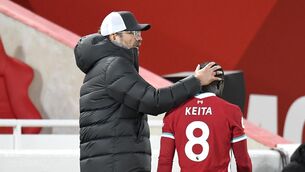 <p>NABY LAD: Liverpool manager Jurgen Klopp consoles Naby Keita as he walks off injured during the Premier League match at Anfield, Liverpool.</p>