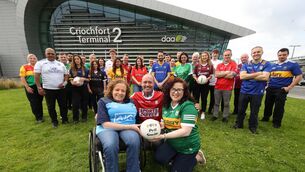 <p>Dublin Airport staff pose with their county jerseys after new figures revealed all 32 counties in Ireland had used Dublin Airport last year</p>