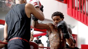 <p>Undefeated WBC/WBA and IBF welterweight champion Errol Spence Jr works on his timing with trainer Derrick James during a media workout at Fight Capital Gym in Las Vegas. Picture: Photo by Steve Marcus/Getty Images</p>