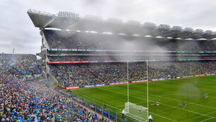 <p>A general view as Paddy Small of Dublin shoots to score his side's first goal despite the efforts of Paul Murphy. Pic: Ramsey Cardy/Sportsfile</p>