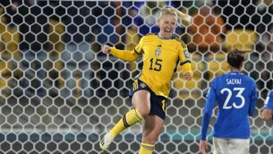 <p>USA AWAIT: Sweden's Rebecka Blomqvist, left, celebrates. Pic: AP Photo/John Cowpland</p>
