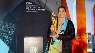 <p>THROWING MUD: Former US football player Carli Lloyd poses with the Women's World Cup trophy during a trophy promotion event in Wellington. Pic: MELVILLE/AFP via Getty Images</p>